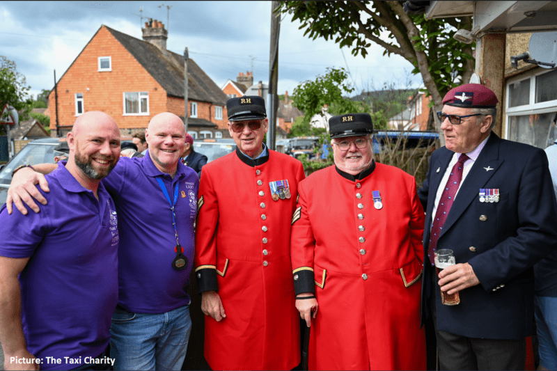 Veterans standing with Taxi Drivers