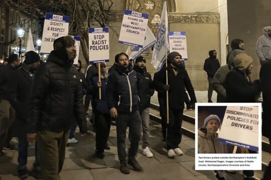 taxi drivers holding picket signs and protesting outside of northampton guild hall