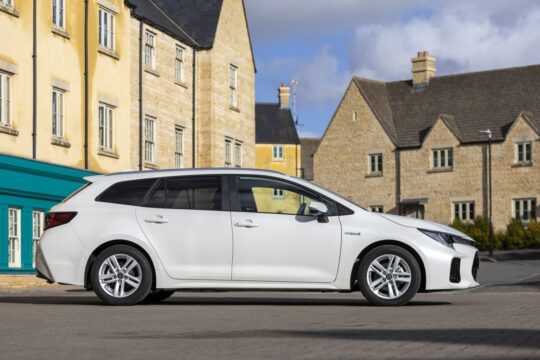 small suzuki swace hybrid vehicle in white