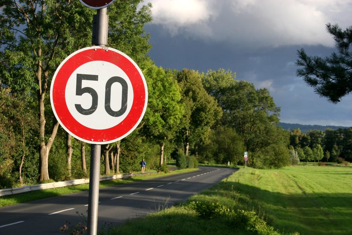 50 mph speed limit sign on a country road