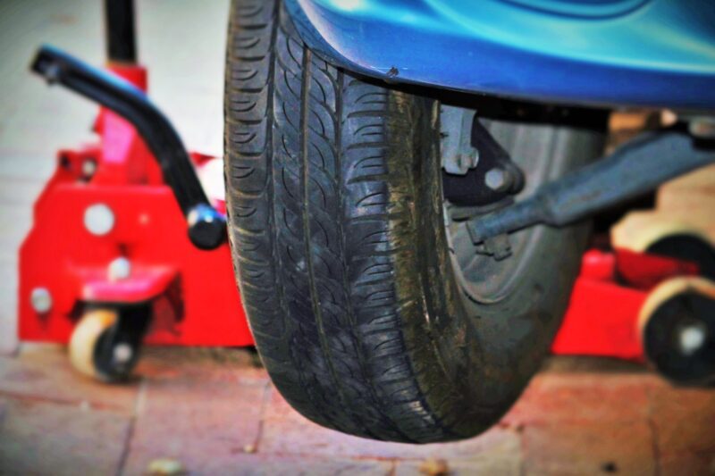 Car tire close up being fixed